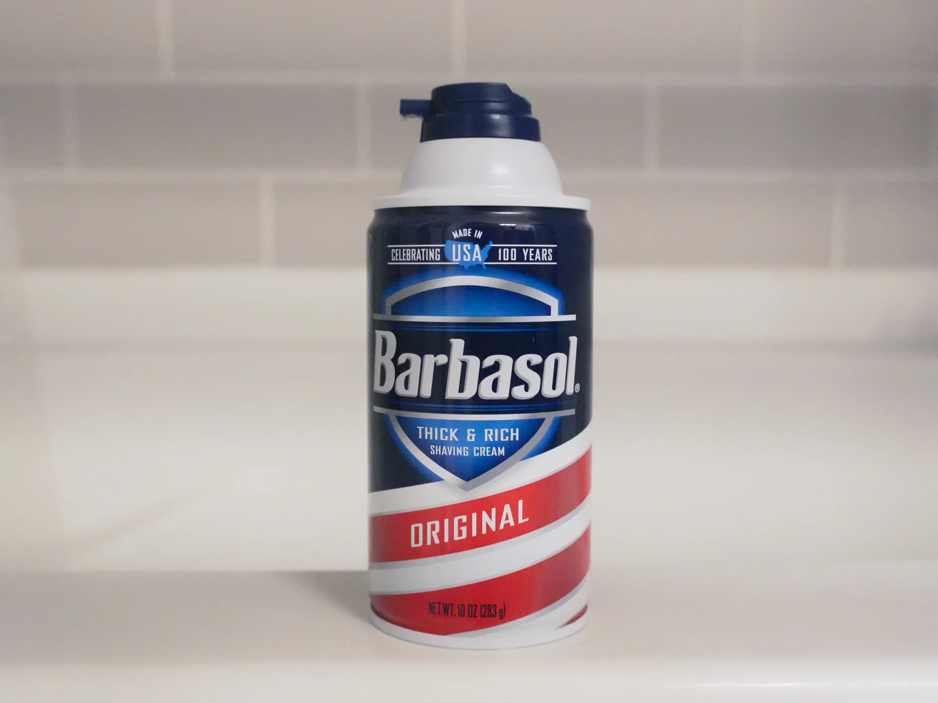 Barbasol Original shaving cream can on a bathroom ledge