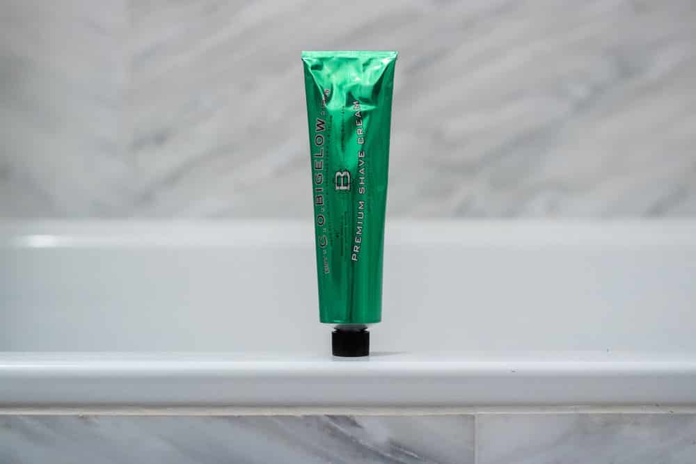 co bigelow shaving cream tub sitting on a bathtub ledge