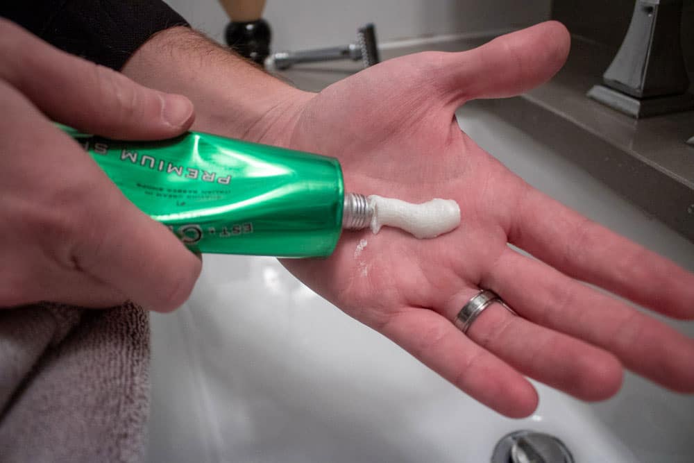 squirting co bigelow shaving cream into palm of hand