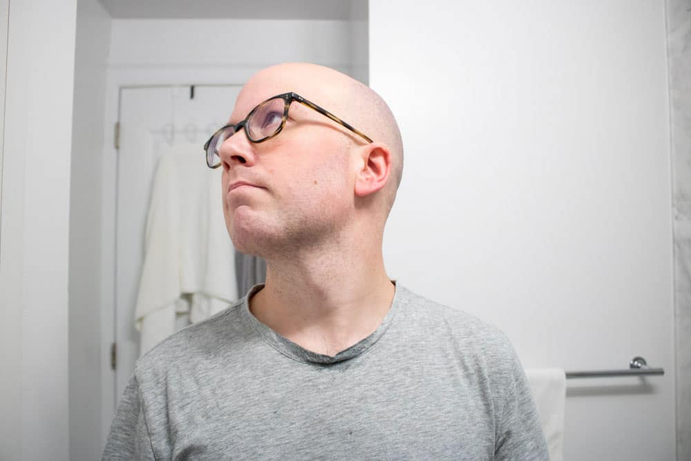 man looking upwards after shaving with cella shave cream 1