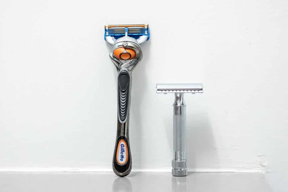 gillette cartridge razor standing next to the merkur 34c