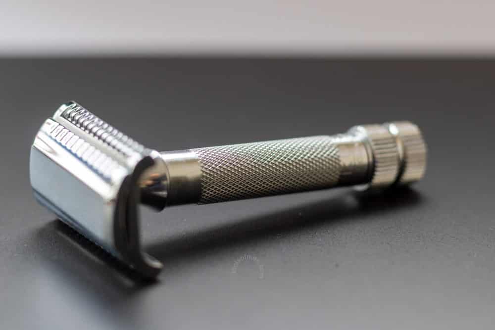 merkur 37c on a black mat with focus on knurled handle