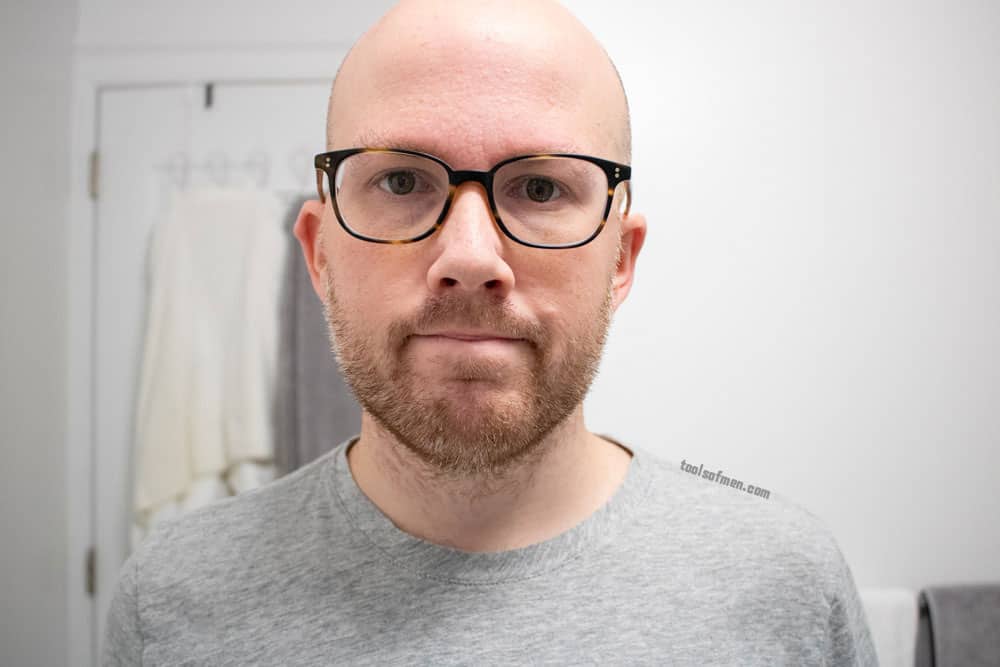 man with short beard looking straight ahead