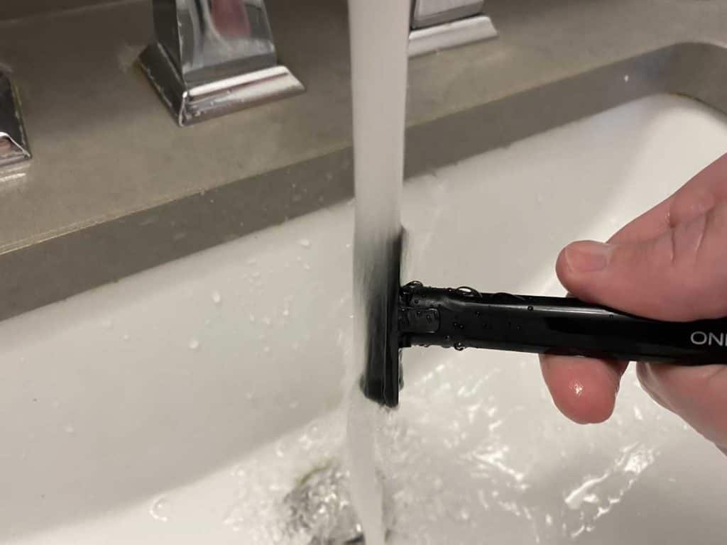 rinsing oneblade core under running water