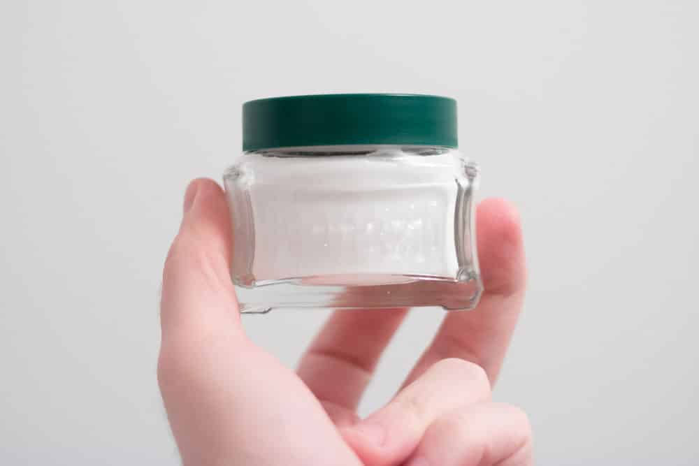 hand holding proraso pre shave cream