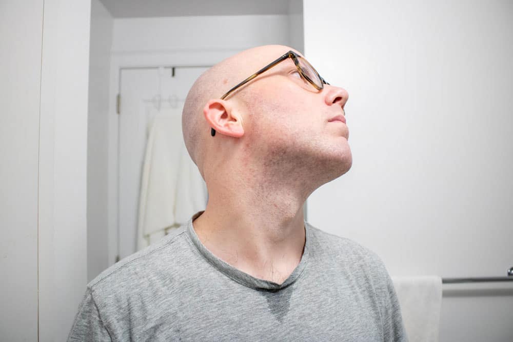 man looking up to the right demonstrating results of shaving cream