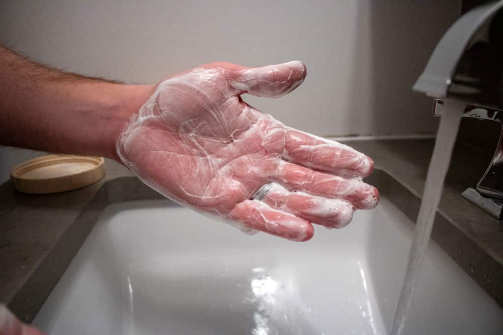 hands coated in taylor of old bond street shaving cream
