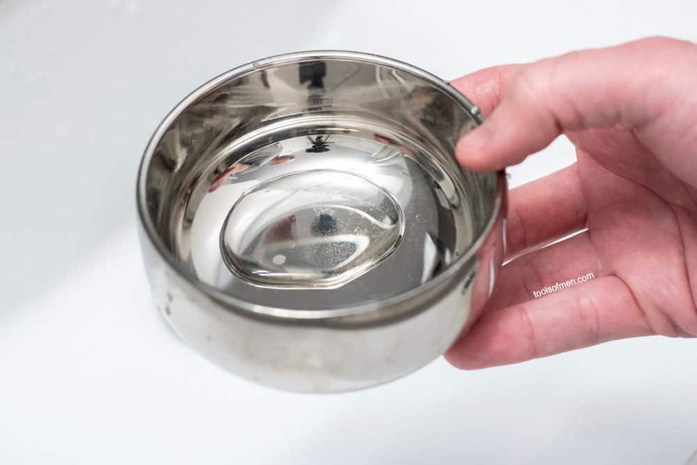 adding water to a shaving bowl