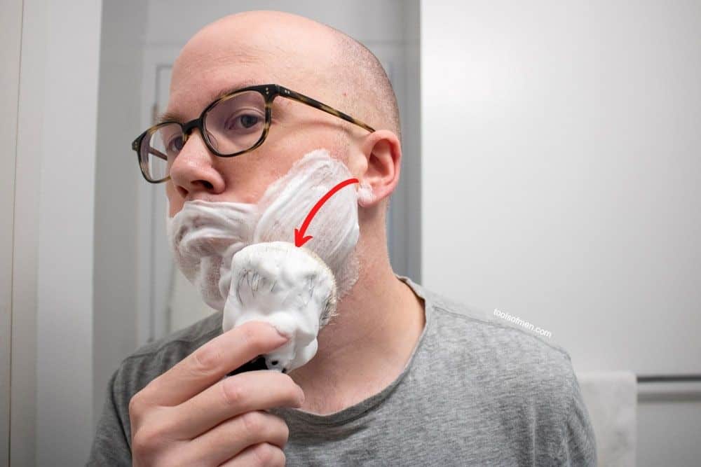applying a shaving cream in straight long passes