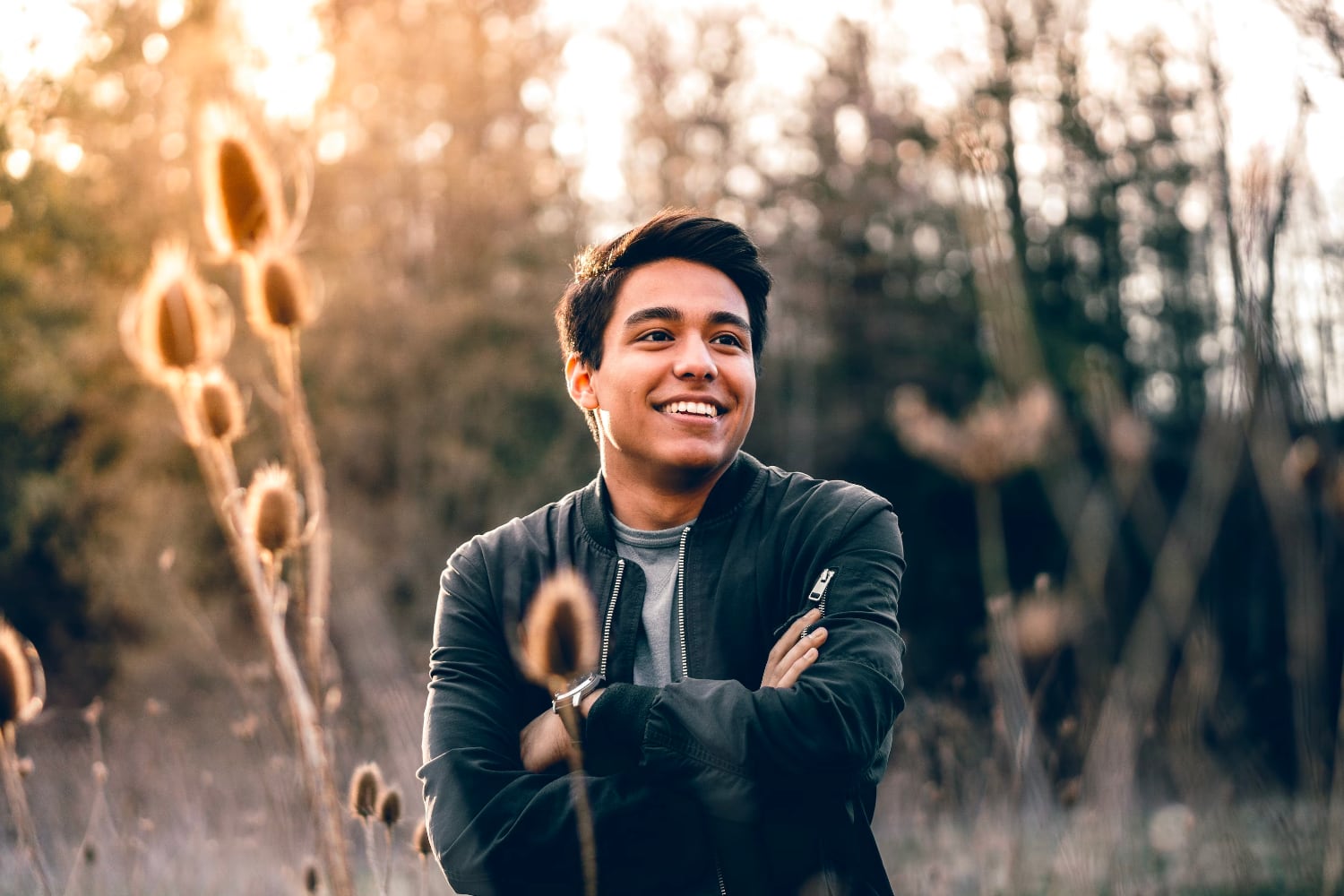man smiling in a field