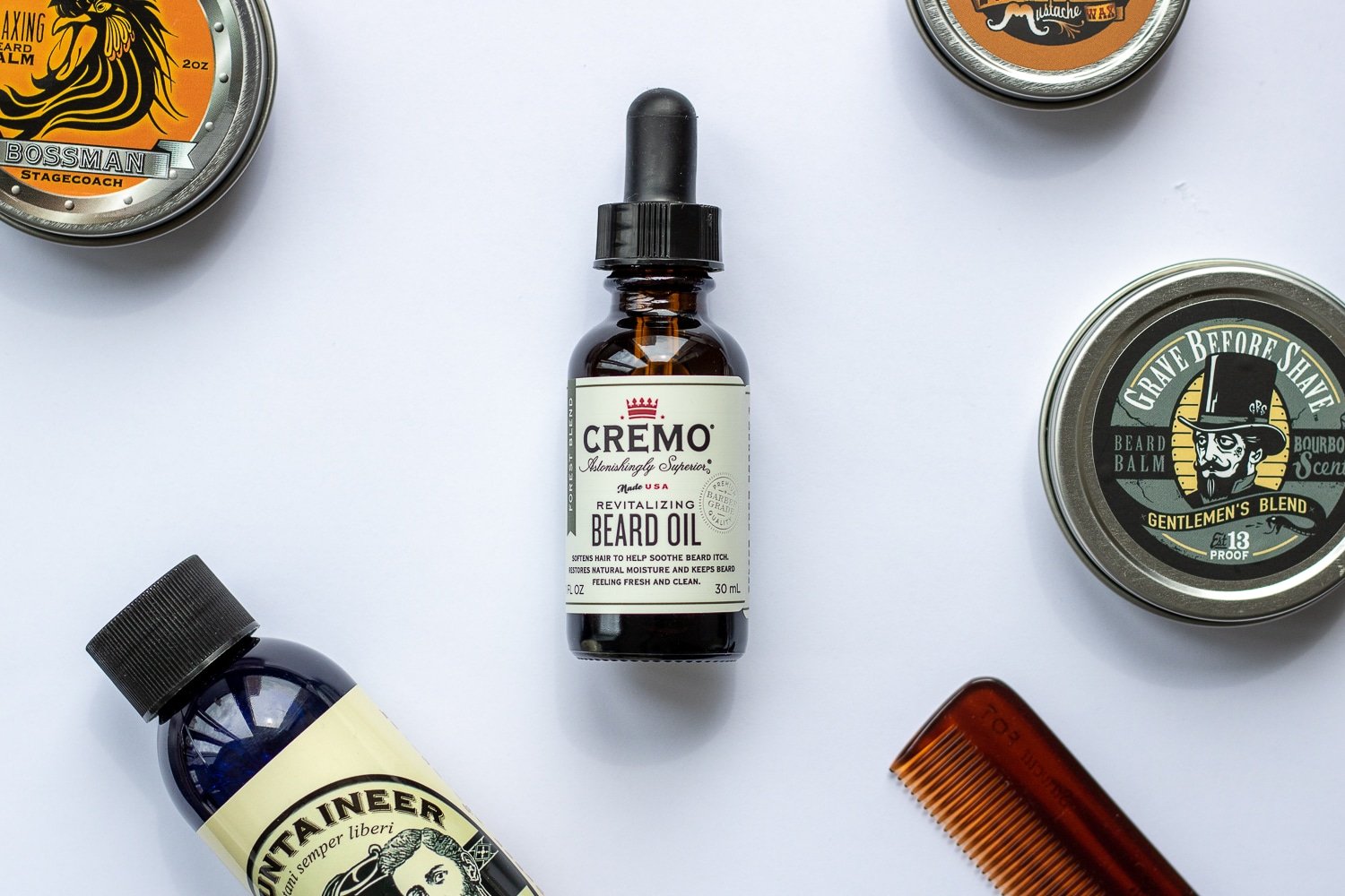 beard oil surrounded by other beard care products