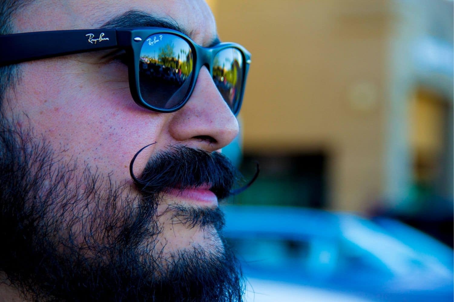 closeup of man with sunglasses and handlebar mustache