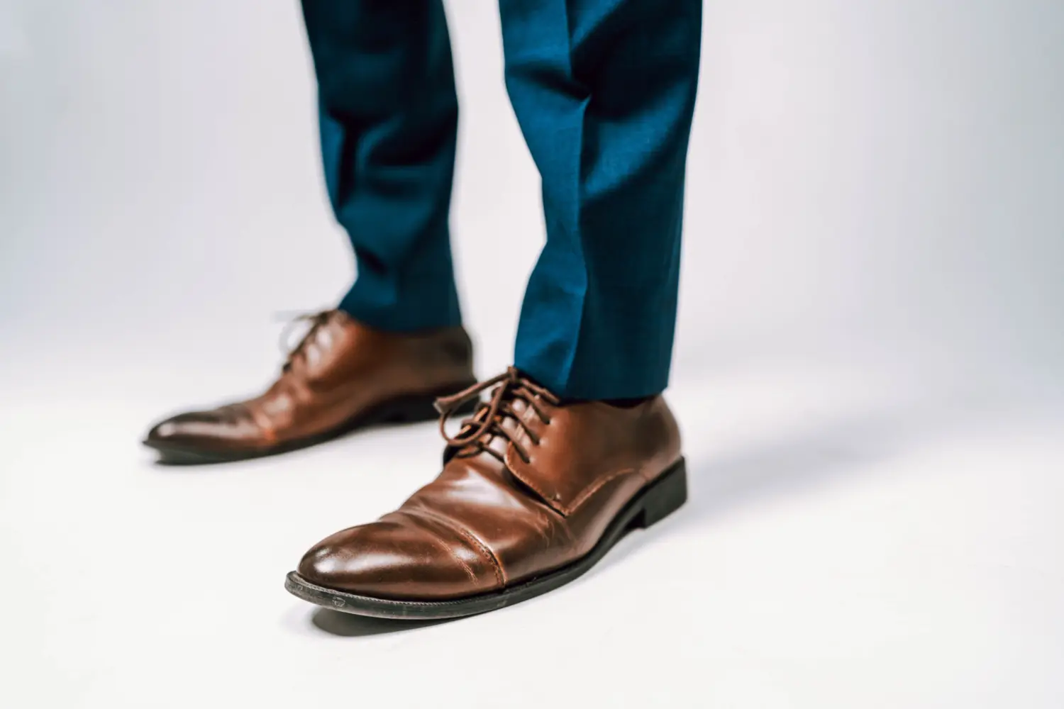 closeup of mans feet in dress shoes