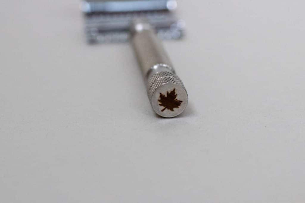 closeup of maple leaf emblem on bottom of the safety razor
