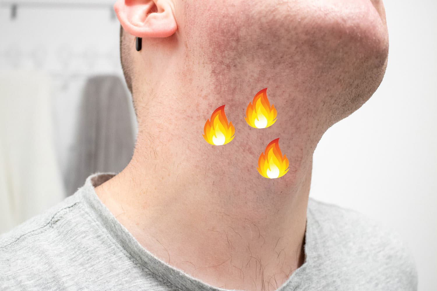 closeup view of neck with fire emojis on it