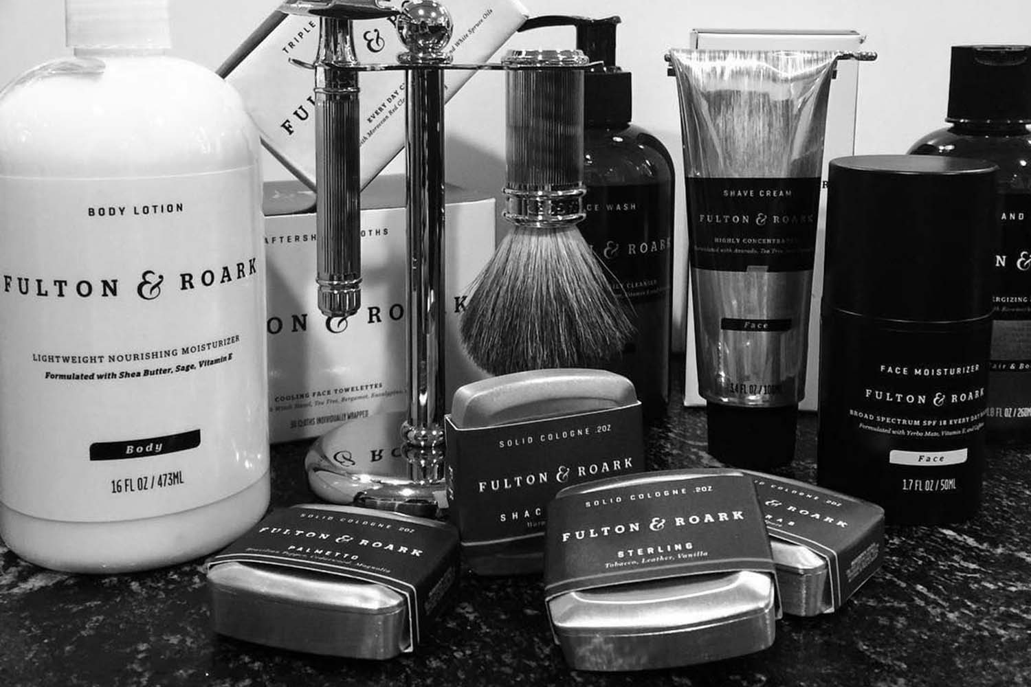 collection of fulton and roark grooming products in black and white
