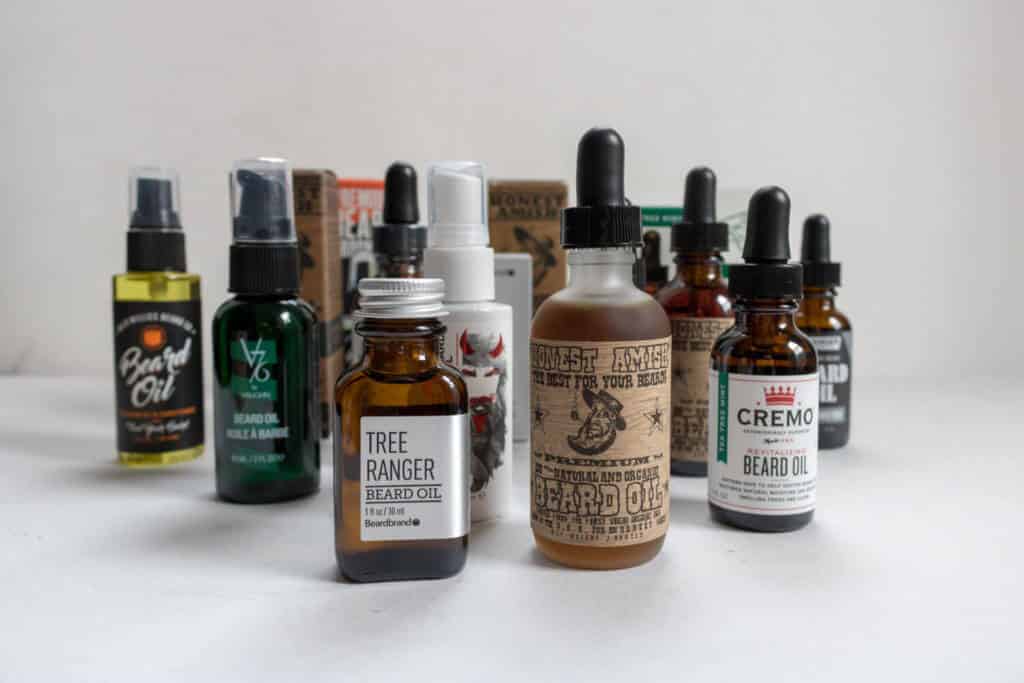 collection of several beard oils next to one another