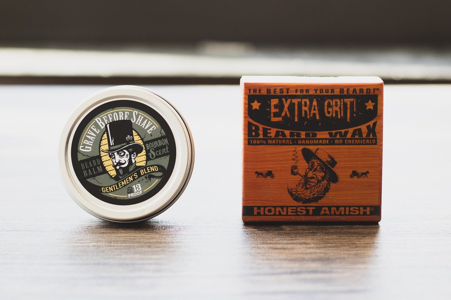 container of beard balm and beard wax sitting on a table