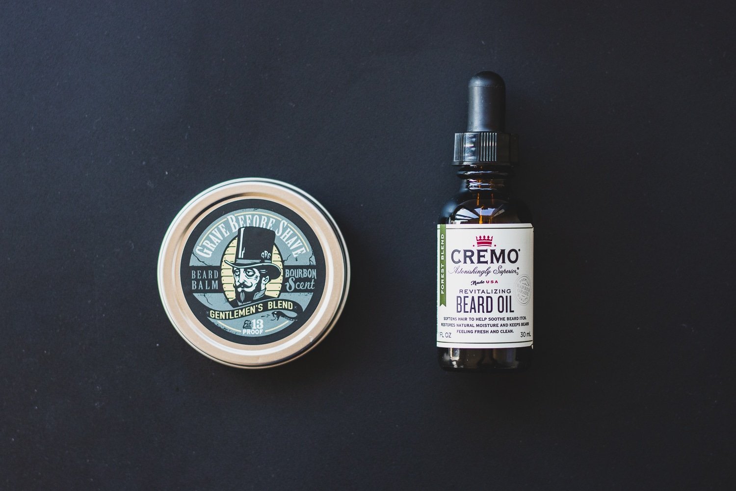 container of beard balm and oil sitting side by side