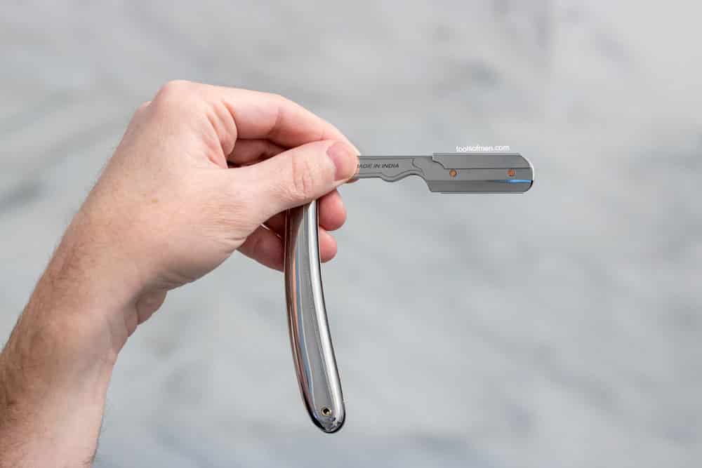 demonstrating the pinch grip on a shavette