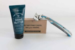 dollar shave club razor and shave butter next to each other