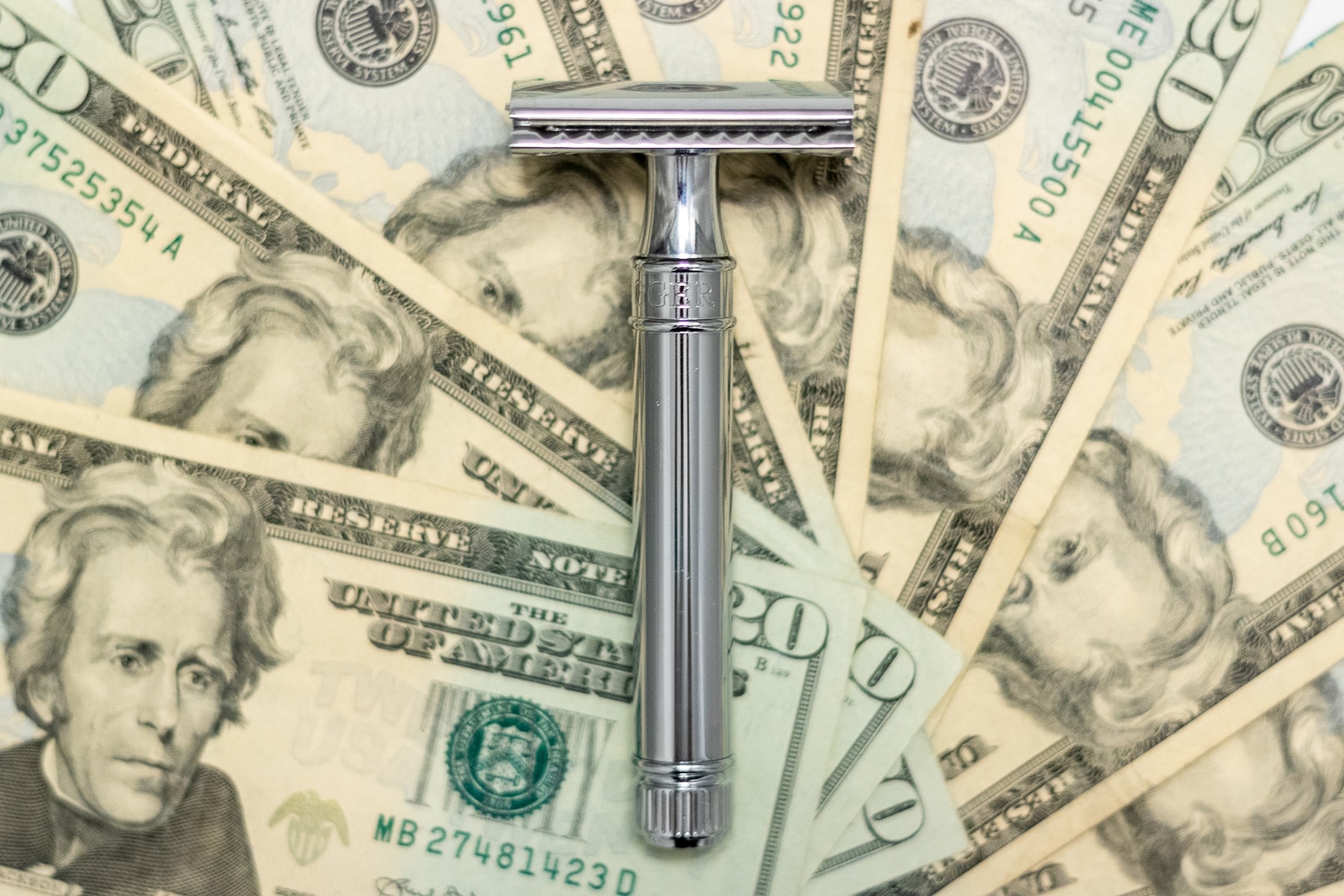 double edge safety razor on USD currency