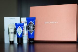 grooming products standing next to a birchbox package