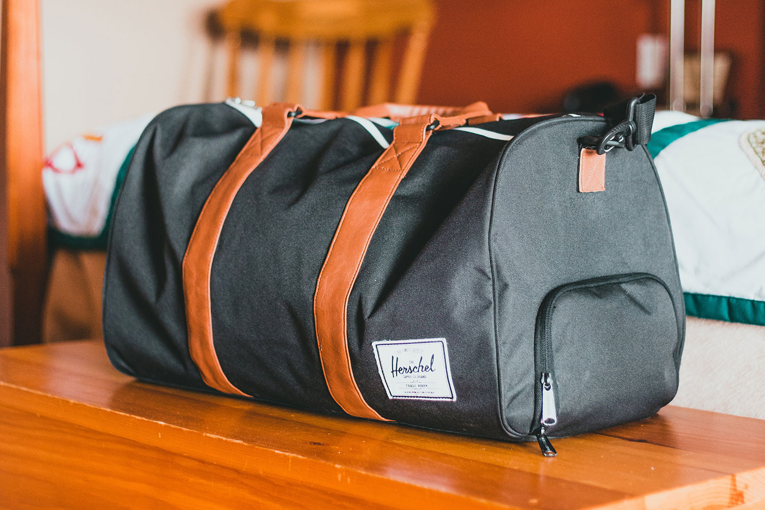 gym bag on brown wooden table