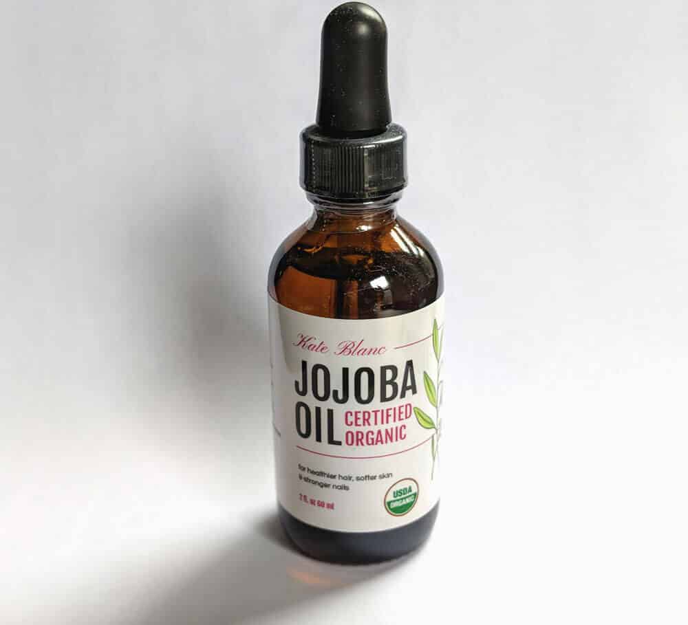isolated shot of a jojoba oil bottle
