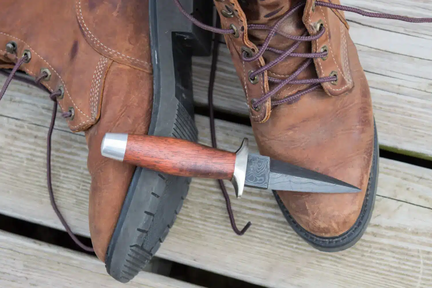 knife sitting on boots
