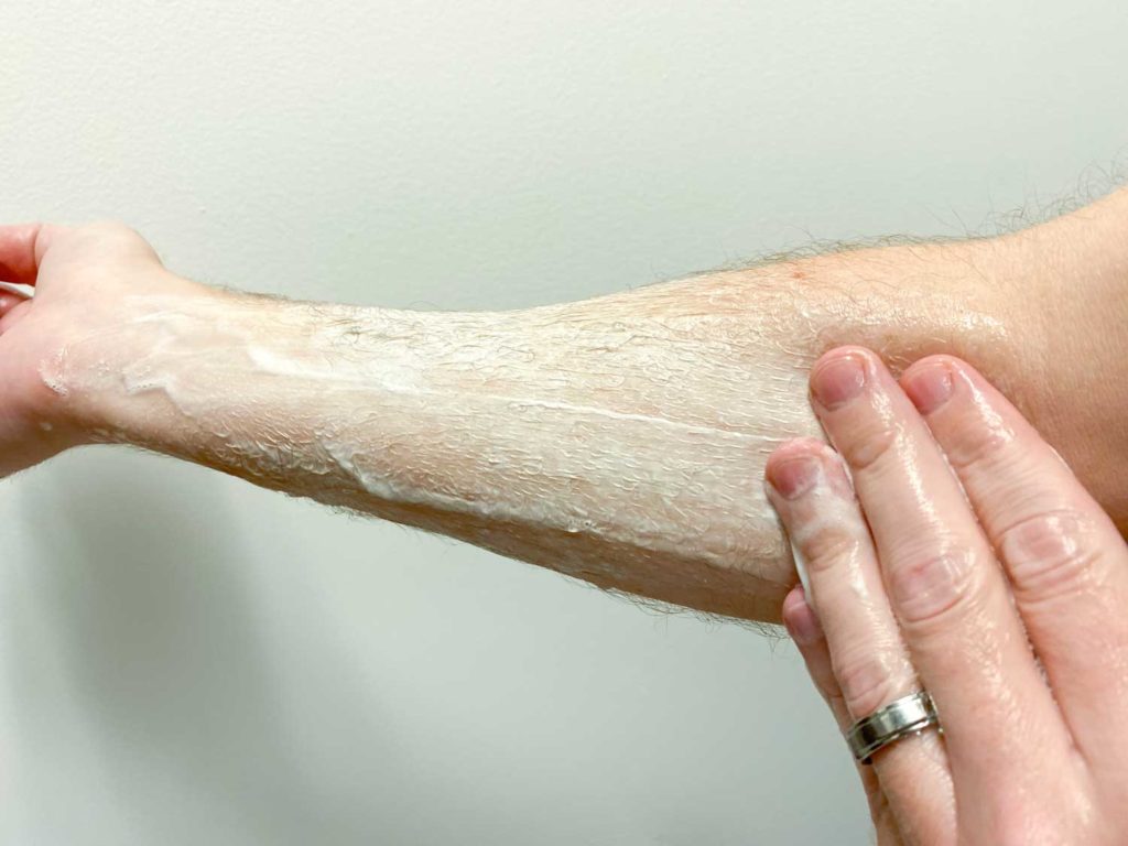 lathering huron face wash on forearm