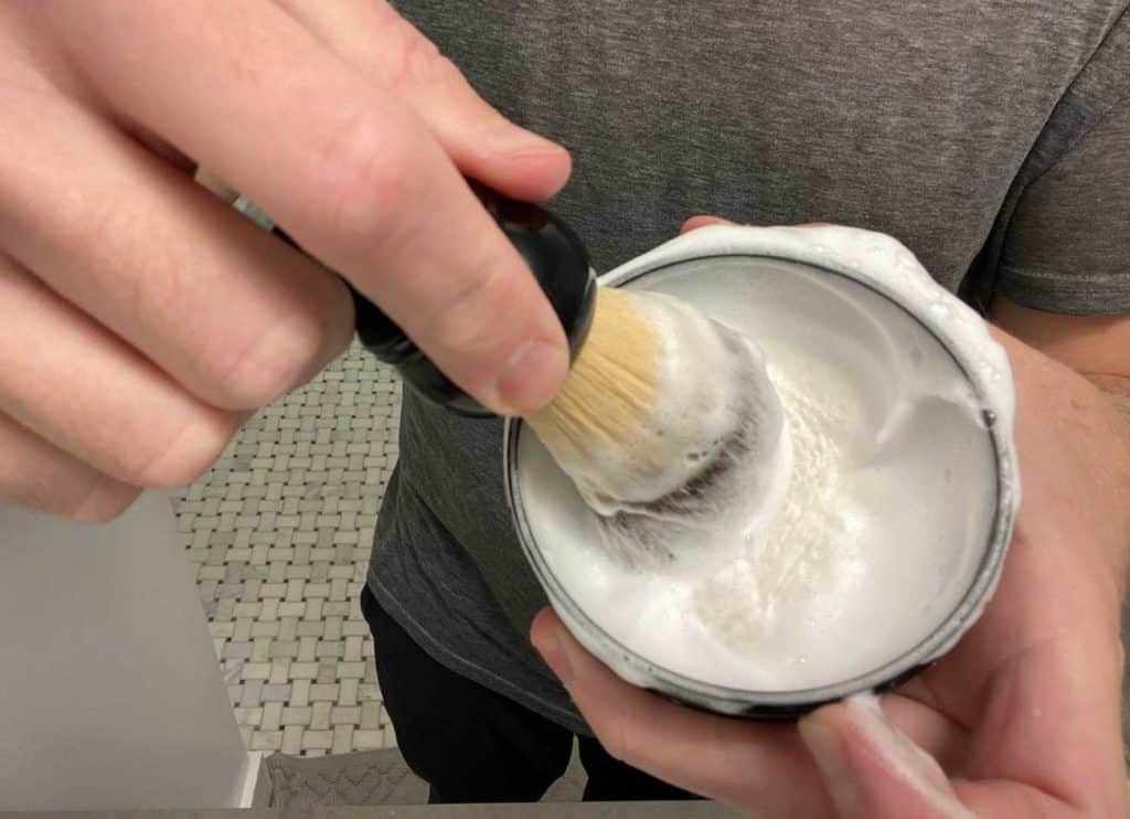lathering shave brush with shave soap