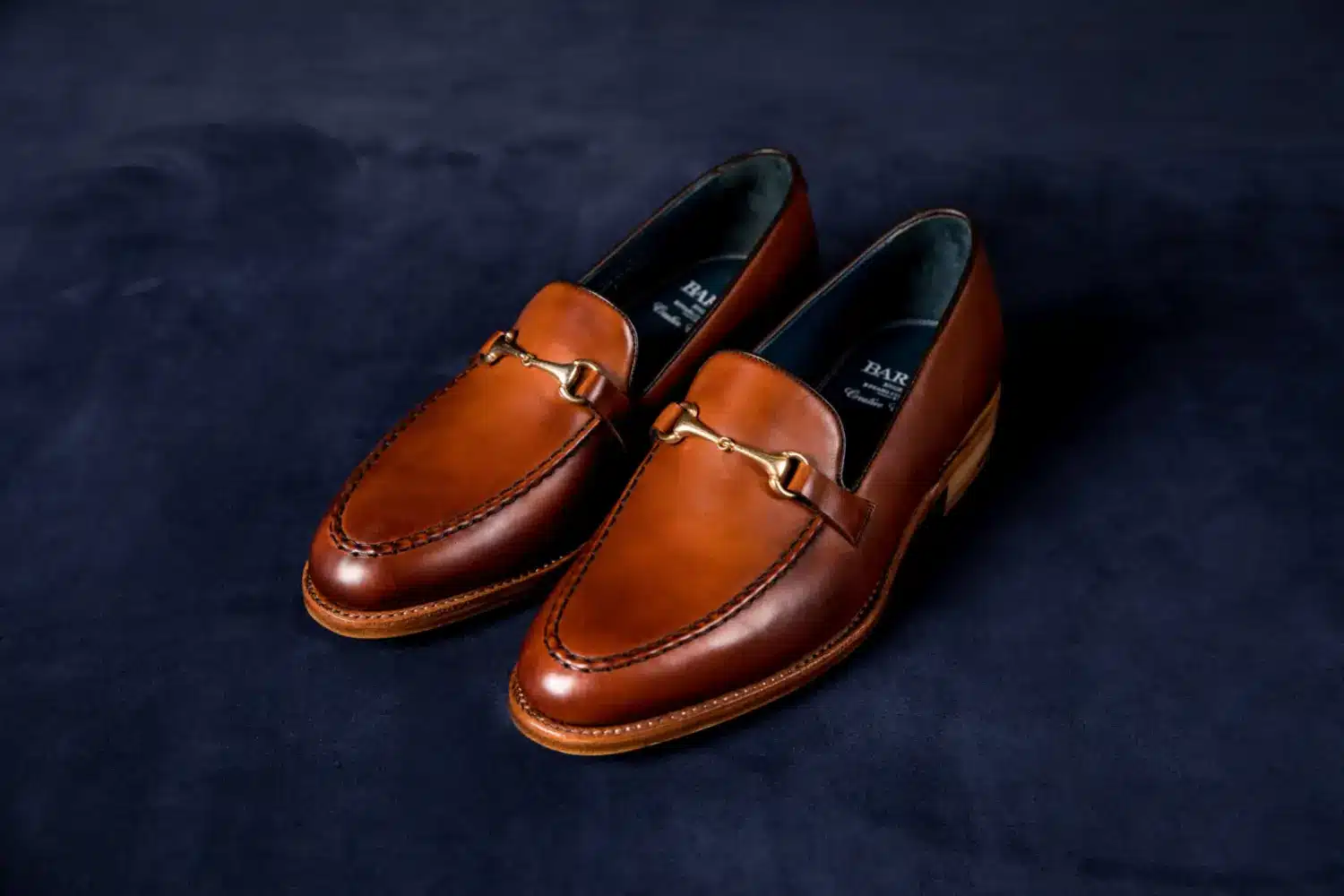leather loafers on a dark background