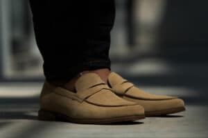 man in suede loafers standing