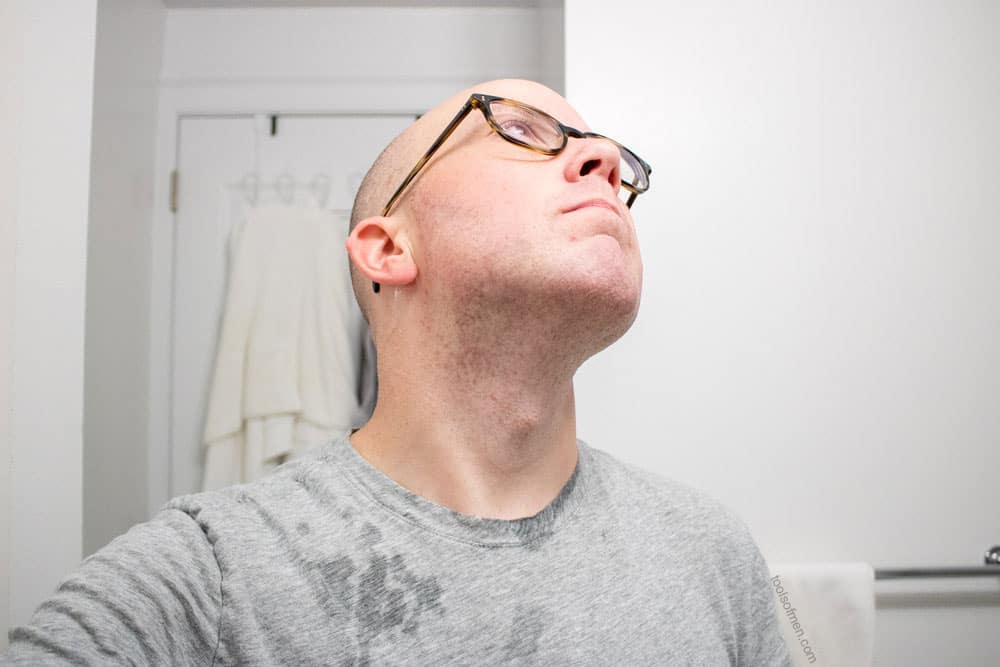 man looking up to show neck after shaving with bevel safety razor