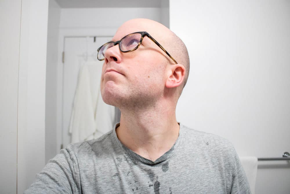 man looking upwards after shaving with ghost town barber shave soap