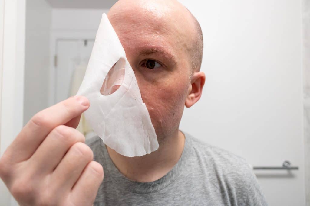 man removing the cardon face mask