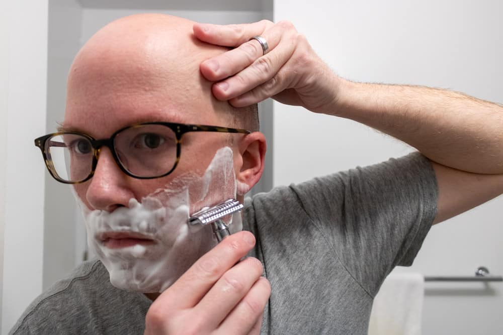 man shaving cheeks with merkur 37c