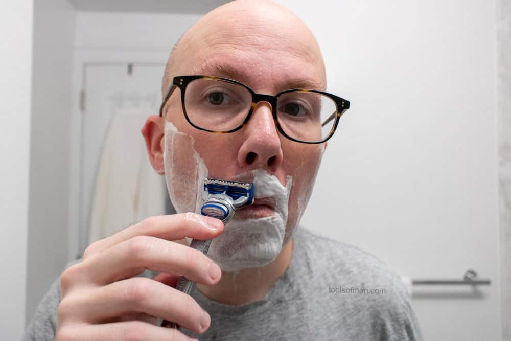 man shaving mustache with gillette skinguard