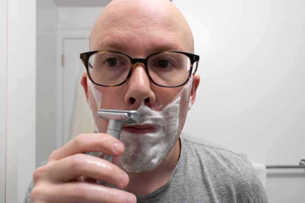 man shaving mustache with merkur futur