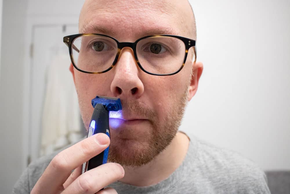 man shaving mustache with microtouch solo