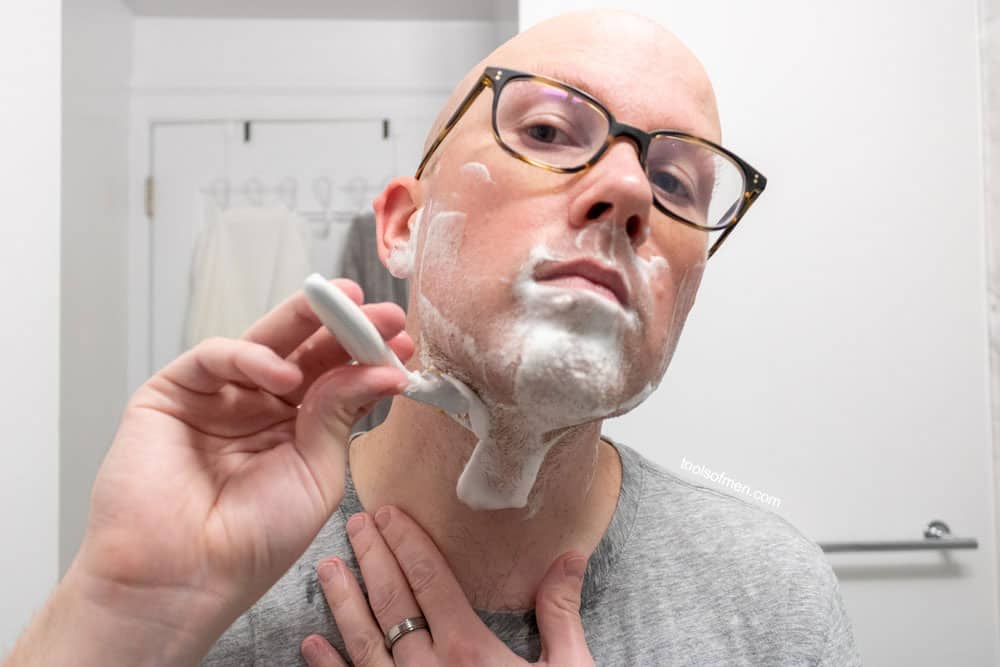 man shaving neck with schick stubble eraser