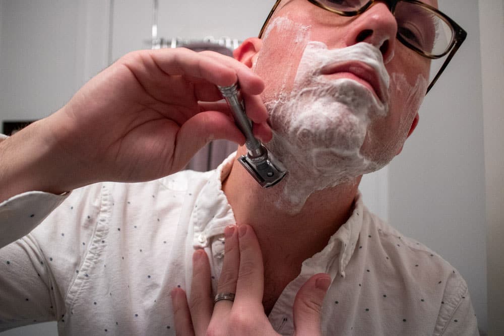 man shaving neck with the merkur 38c