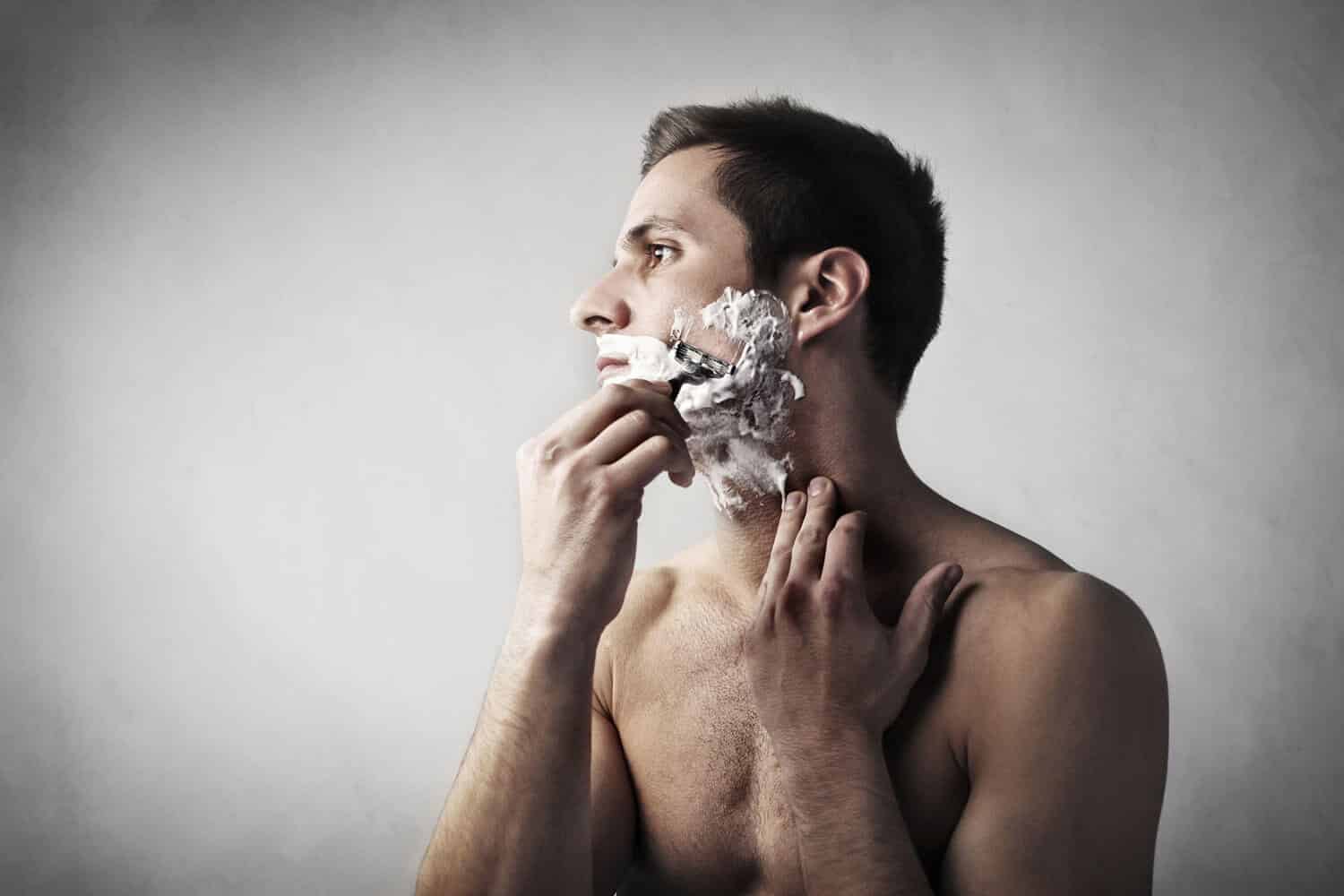 man shaving with a cartridge razor