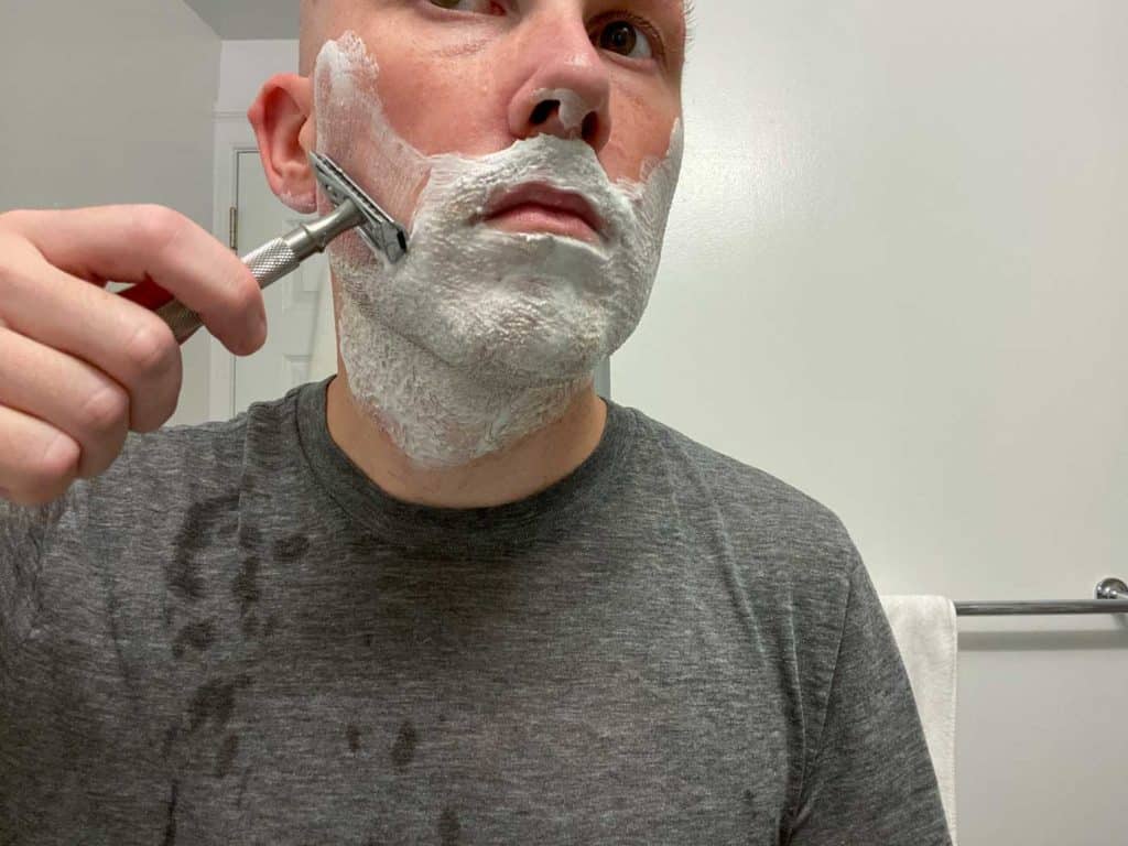 man shaving with a maggard safety razor