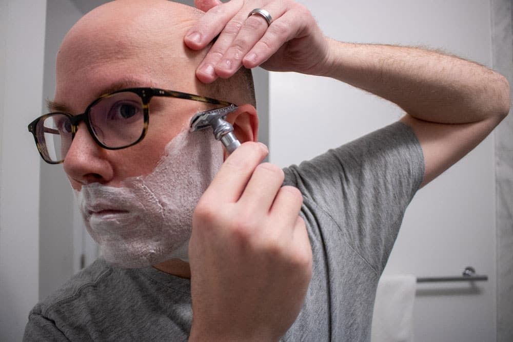 man shaving with a safety razor 1