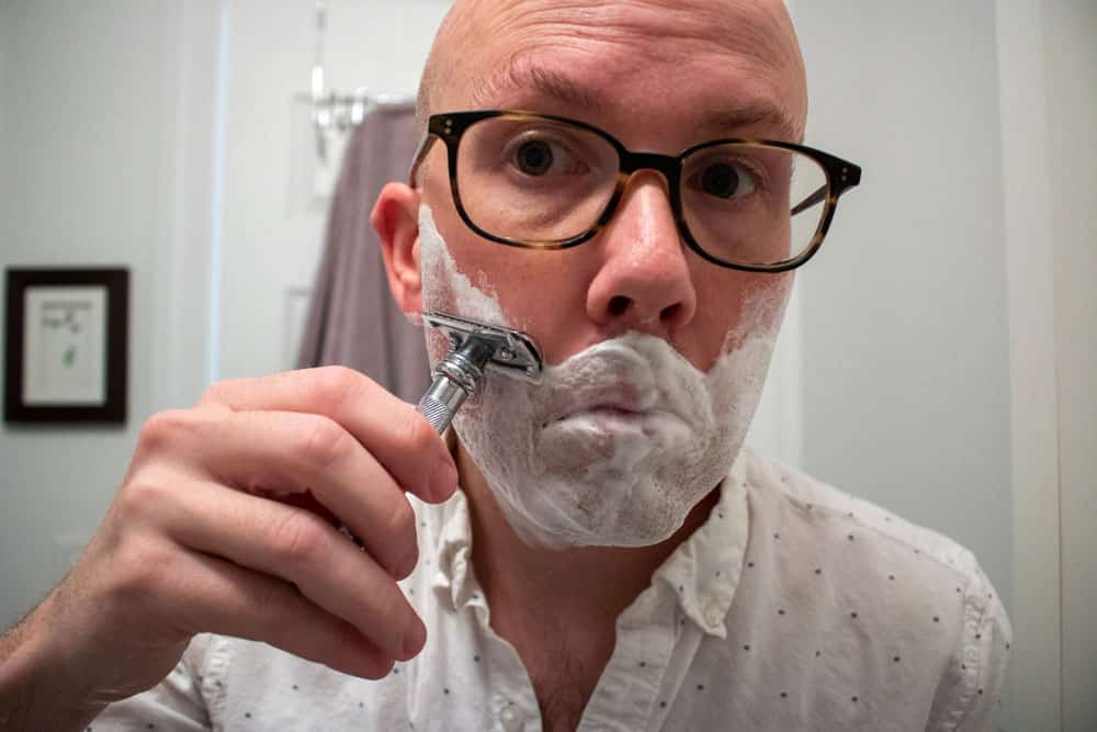 man shaving with a safety razor 2