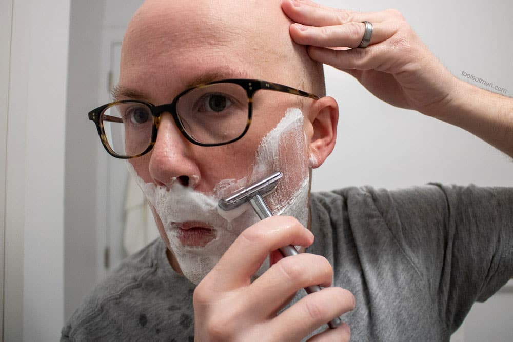 man shaving with bevel safety razor 4