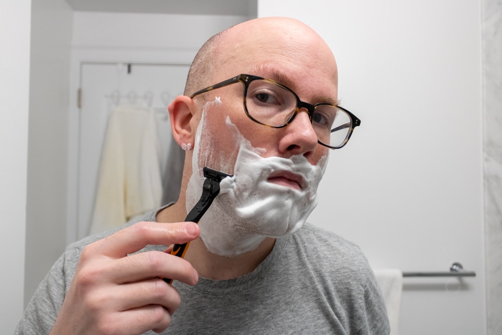 man shaving with the microtouch tough blade