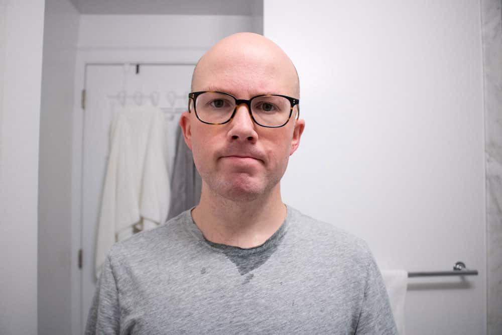 man staring at camera after shaving
